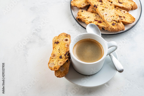 Fotomural Christmas homemade cookies biscotti with dry berries and cup of coffee