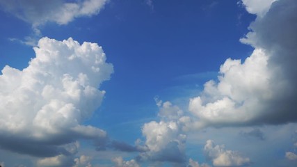 Wall Mural - time lapse of white cloud on a light blue sky. the formation of clouds before the typhoon occurred. 