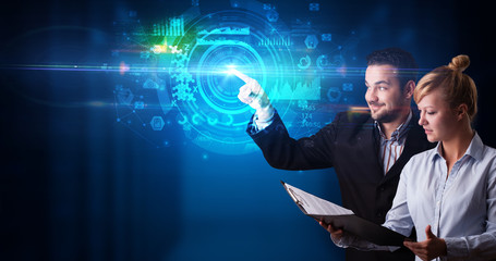 Man and woman touching hologram screen displaying medical symbols and charts