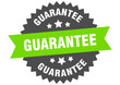 guarantee sign. guarantee green-black circular band label