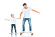 © LIGHTFIELD STUDIOS - happy father and son holding hands while riding penny boards on white