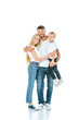 © LIGHTFIELD STUDIOS - happy man hugging wife while holding in arms son on white
