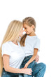 © LIGHTFIELD STUDIOS - happy mother and preteen daughter looking at each other isolated on white