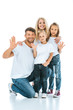 © LIGHTFIELD STUDIOS - happy parents and kids waving hands and looking at camera on white