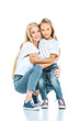 © LIGHTFIELD STUDIOS - happy mother and daughter hugging and looking at camera on white