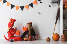 Cheerful Cute Children In Costumes Ready For Trick-or-treating Halloween Holiday Concept