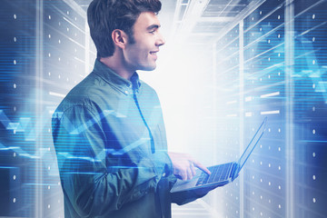 Poster - Smiling young programmer in data center