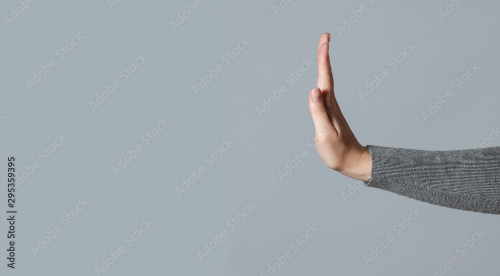 Woman showing a refuse hand gesture sign. - obrazy, fototapety, plakaty 