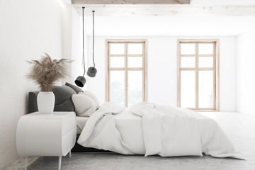 Side view of luxury white bedroom interior