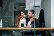 Beautiful caucasian couple in love drink coffee at cafe. Love and romantic concept.