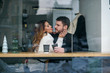 © gorynvd - Beautiful caucasian couple in love drink coffee at cafe. Love and romantic concept.