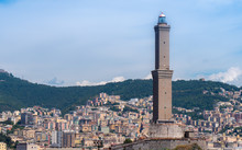 GENOA - August 14 2019: The Lighthouse Of Genoa (La Laterna), With City In A Background.