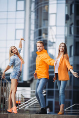 Wall Mural - Happy friends walking with bags after Black Friday shopping