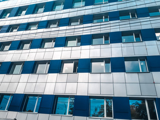 modern office building with reflection in windows of building