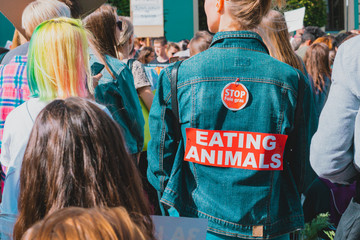 Animal rights activist in crowd. Stop foie gras. Stop eating animal. Woman at Animal Rights Protest. Rally