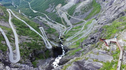 Wall Mural - Aerial view. Trolls Path Trollstigen winding scenic mountain road with viewing platform in Norway Europe. National tourist route