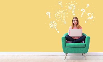 Poster - question marks with young woman using her laptop in a chair