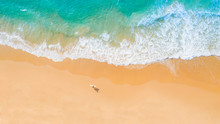 Aerial View Of Sandy Beach And Ocean With Waves