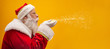 © Brastock Images - Holly jolly Xmas festive occasion Noel! Christmastime traditions! Santa in headwear, costume, white gloves expresses winter wish, surprise, fantasy, blizzard, snow, snowflakes, air kiss, blowing