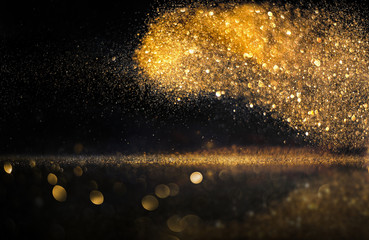 Wall Mural - glitter lights grunge background, gold glitter defocused abstract twinkly gold lights background.