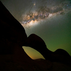 Wall Mural - beautiful view of night landscape milky way over rock arch spitzkoppe, namibia.