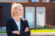 © Acronym - Outdoor photo of young and attractive businesswoman, retailer or student. Woman in casual wear. Real estate, business and education.