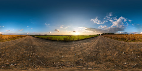 Wall Mural - full seamless spherical hdri panorama 360 degrees angle view on gravel road among fields in summer evening sunset with awesome clouds in equirectangular projection, ready for VR AR virtual reality