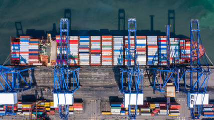 Wall Mural - Container ship is loading in a port, Aerial top view container ship.