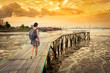© Olga Khoroshunova - Tourist with backpack at Yeoh jetty, Georgetown, Penang, Malaysia