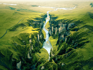 rugged landscape of fjadrargljufur canyon in iceland. aerial shot.