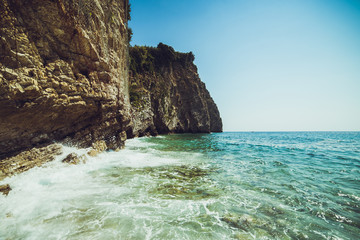 Adriatic coast in summer. The height of the tourist season. Transparent warm sea and mountains. Montenegro.