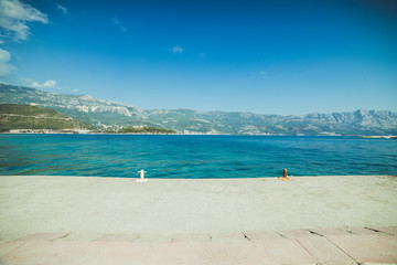 Adriatic coast in summer. The height of the tourist season. Transparent warm sea and mountains. Montenegro.