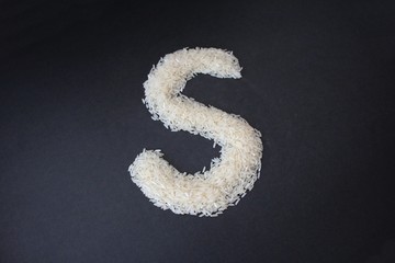 Letter S formed from rice grains