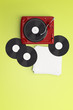 © chayathon2000 - vintage turntable with vinyl and coffee latte art on color background