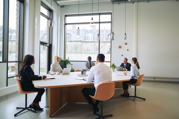 Diverse group of smiling businesspeople having a boardroom meeti