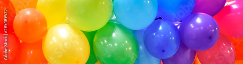 Cuadros en Lienzo Wide celebration banner background with rainbow multicolored balloons
