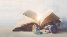 Mystical Composition With  Minerals And Crystals And Ancient Book. Study Of Properties Of Minerals And Rocks, Practice Spells. Crystal Ritual, Witchcraft. Shallow Depth. Grunge Filter, Soft Focus