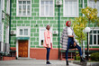 © AS Photo Family - Two young modern fashionable, attractive, tall and slim african muslim womans in hijab or turban head scarf and coat posed.
