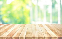 Empty Wood Table Top On Blur Abstract Green Garden From Window View Background