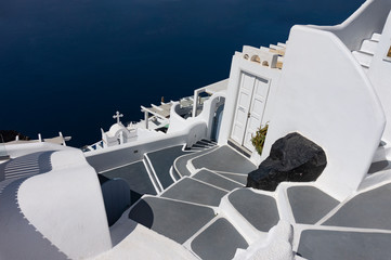 Simple beautiful white architecture in Santorini Greece over the blue sea