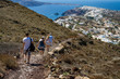 © Bernadett - Fira Oia trail with hikers and the view of Oia from above