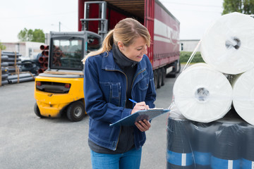 industrial supplier clerk inspecting delivery product