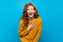 Redhead Woman With Yellow Sweater Smiling A Lot