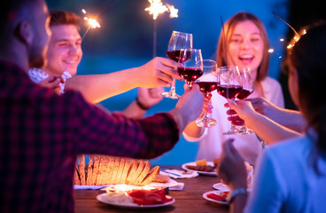 happy friends having french dinner party outdoor