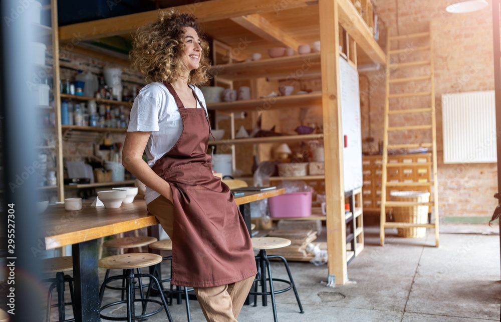 Portrait of woman pottery artist in art studio Stock Photo | Adobe Stock
