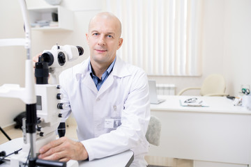 Poster - Successful professional optometrist working with new eyesight check-up equipment