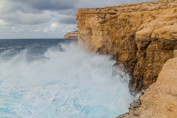 Wall Mural - Cliffs of Dwejra, location of the collapsed Azure Window on the island of Gozo, Malta