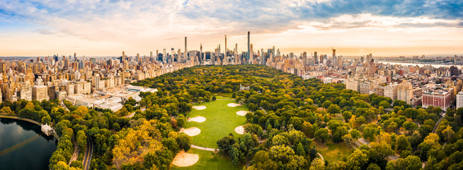 Fototapete - Aerial panorama of New York midtown skyline at sunset viewed from above Central Park.