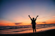 © Sumstudio - Happy man on the sunset in nature in summer with open hands