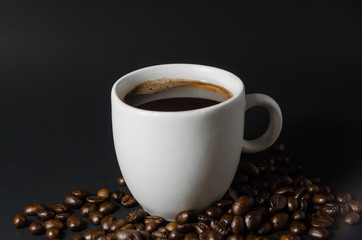 white coffee cup with coffee beans